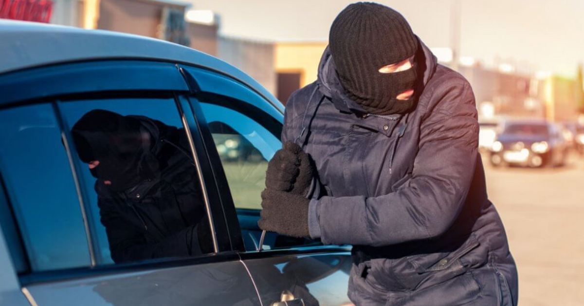 a person breaking into a car