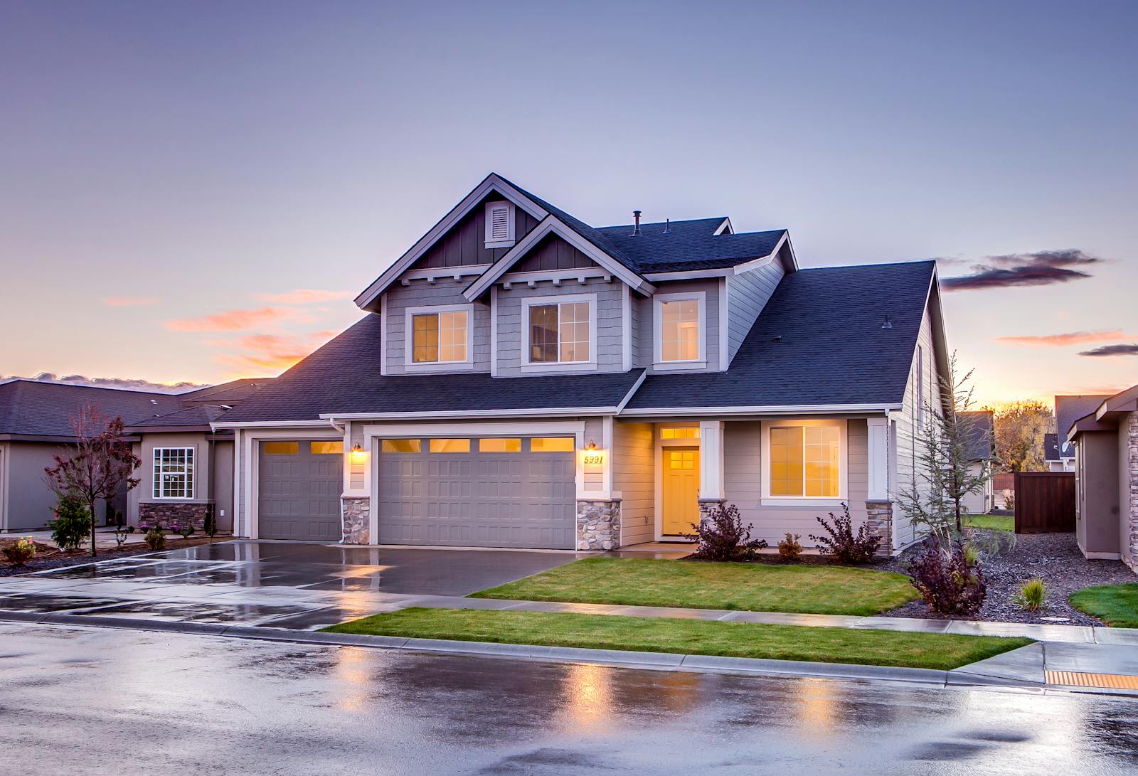 Elegant suburban home with driveway at sunset showcasing modern architecture. home